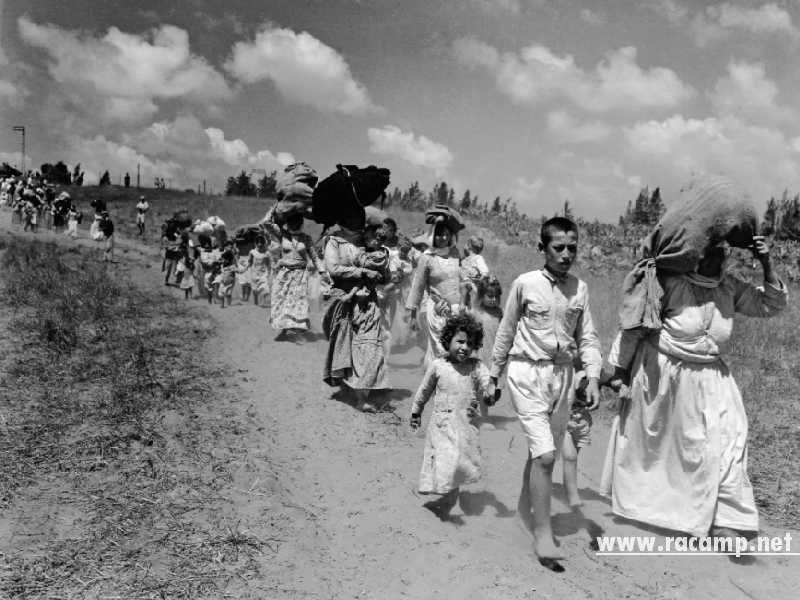 Palestinian refugees fleeing their homes near Haifa, June 1948 Credit_ Corbis