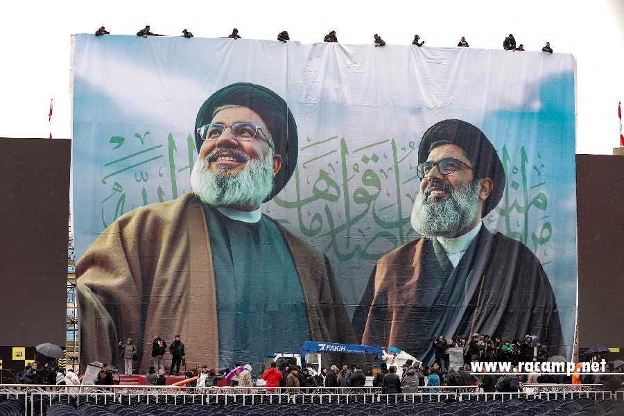 A giant banner bearing the portraits of Hezbollah's slain leader Hassan Nasrallah (L) and  Hashem Safieddine, who was chosen to succeed him before he was also killed, hangs in Beiruts Camil Chamoun sports city on February 22, 2025, as preparations take place a day ahead of their funeral ceremony. Lebanon's Hezbollah is preparing for a massive turnout for the funeral of its slain leader Hassan Nasrallah, an opportunity for a show of strength by the Iran-backed group after a bruising war with Israel. Safieddine will be buried on Monday in his southern hometown of Deir Qanun al-Nahr. (Photo by Ibrahim AMRO / AFP)